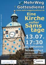 Der Turm der St. Johanniskirche Schweinfurt vor blauem Himmel. Die Kirchturmuhr sieht aus wie eine Nase zwischen den zwei Fenstern als Augen. Darunter ist mit einem Strich ein Mund angedeutet. Die Kirche ist übersät mit kleinen blauen Punkten.